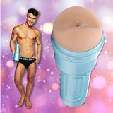 A smiling man in black underwear holds the Fleshlight Fleshjack Boys Allen King: Realistic Male Masturbator Majestic Cake Butt, shown enlarged beside him, against a pink and purple bokeh background.