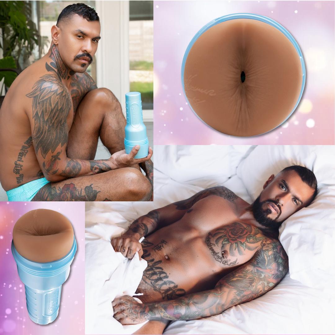 Tattooed Boomer Banks poses with the Fleshjack Boys Boomer Banks: Realistic Male Masturbator Cake Butt by Fleshlight, highlighting its lifelike orifice and signature blue case against a sparkling pink backdrop.