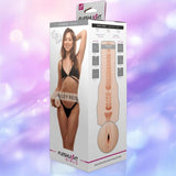 The Fleshlight Girls: Riley Reid Utopia retail box by Fleshlight features Riley Reid in black lingerie and a diagram of the Utopia sleeve’s lifelike SuperSkin texture on a pastel purple background.
