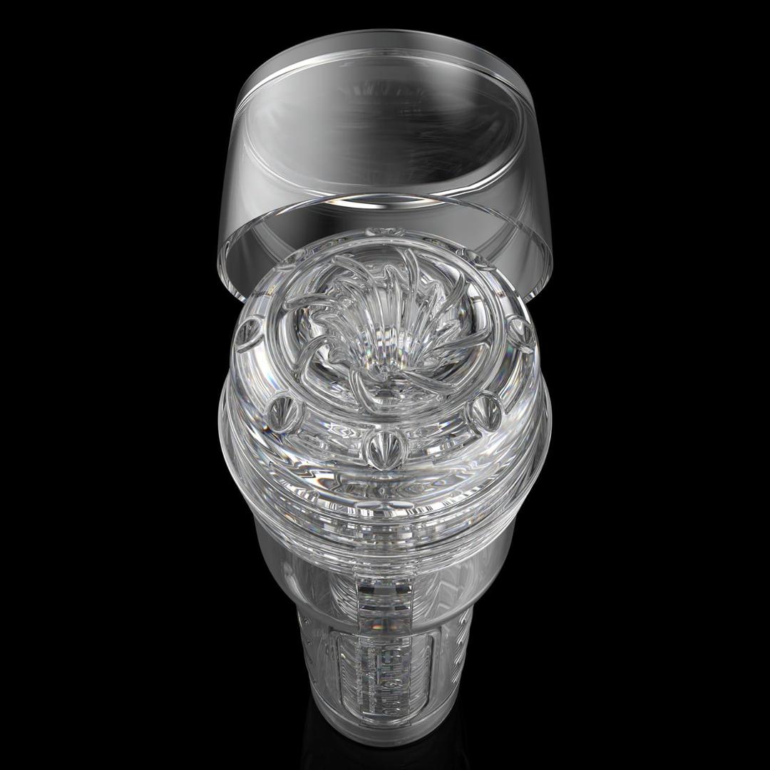 The Fleshlight GO Torque Portable Stroker by Fleshlight is a transparent, cylindrical male masturbation toy with a removable lid and intricate flower-like top design—perfect for travel, shown against a black background.