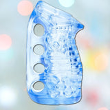 The Fleshlight Fleshskins Grip Male Masturbator with Squeeze Control, a transparent blue plastic item with finger holes, is designed to resemble a massage or grip exercise tool. Set against a soft-focus background adorned with bokeh lights, this product showcases its sleek and modern appeal.