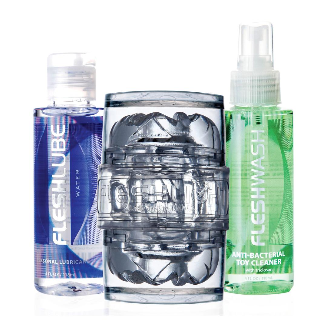 The Fleshlight Quickshot Vantage Value Pack by Fleshlight includes a masturbation sleeve, lube, and toy cleaner, all displayed upright on a white background.