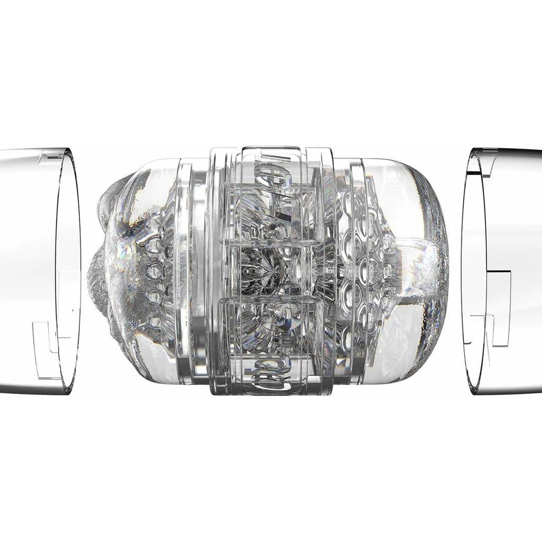 A clear plastic cylindrical device with intricate internal components, encased by two transparent outer sections, resembles the Fleshlight Quickshot Stoya Destroya Male Masturbator by Fleshlight. The design includes textured details and appears to be part of a mechanical or electronic system.