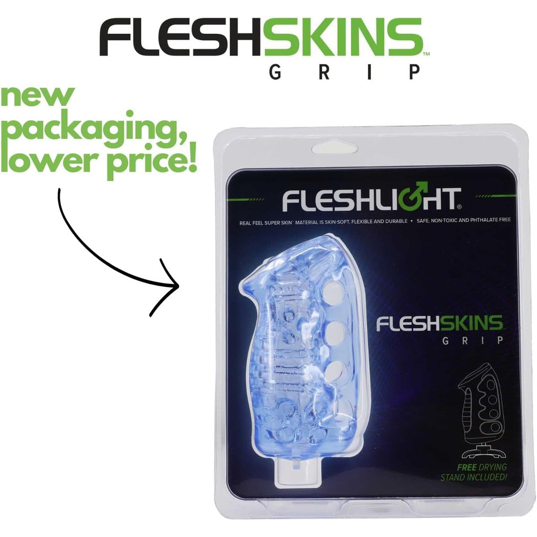 The Fleshlight Fleshskins Grip Male Masturbator with Squeeze Control is now presented in a transparent packaging featuring blue accents within a protective plastic case. Accompanying text highlights, "new packaging, lower price!" and announces that a "free drying stand included!" Experience enhanced pleasure with its innovative Superskin design and squeeze control feature.