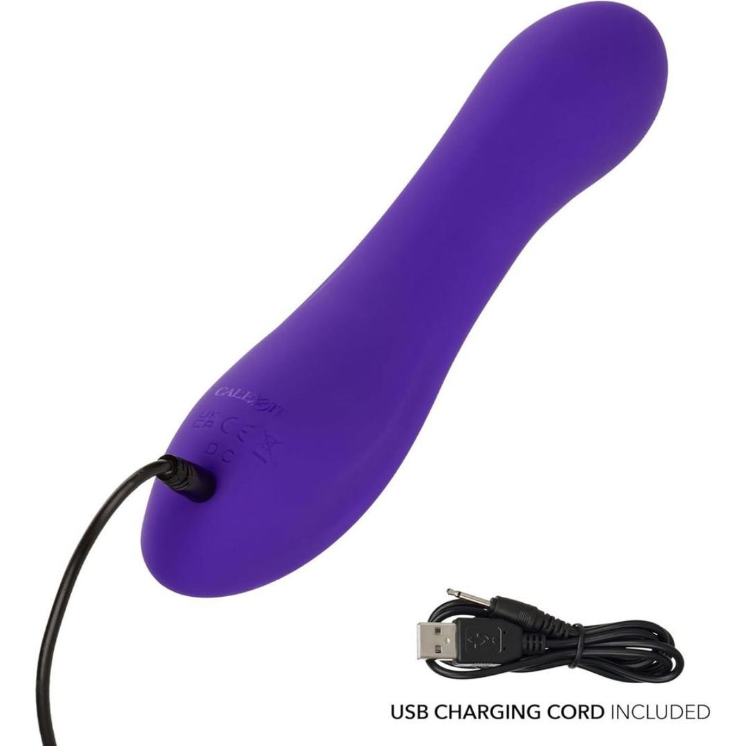 The CalExotics Flex Bend & Hold Rumbler G-Spot Stimulator, shown in purple with a curved design, is charging via a USB cable; a close-up highlights the included USB charging cord.