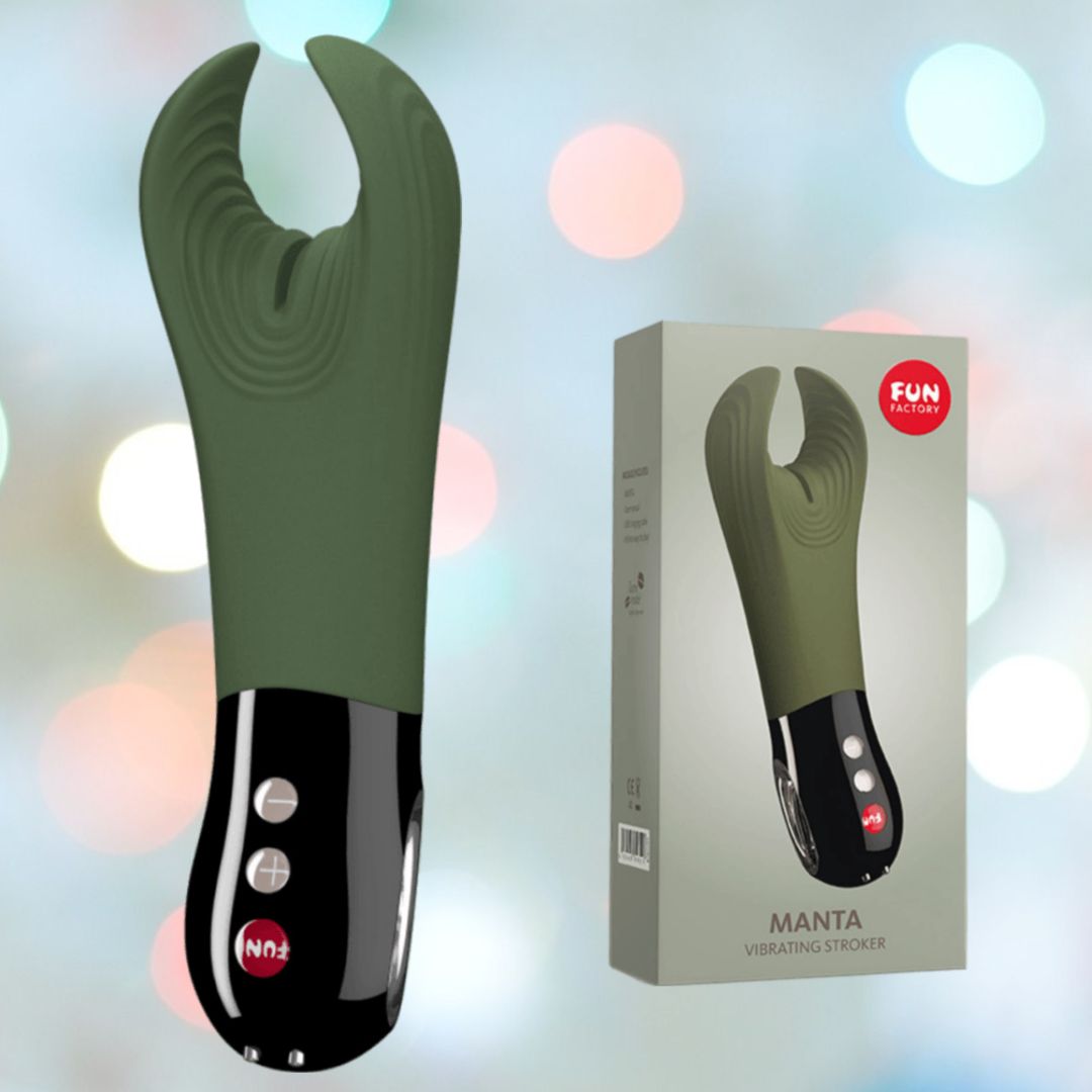 The Fun Factory Manta Rechargeable Vibrating Male Stroker for Men in Moss Green, featuring a sleek black handle and intuitive control buttons, is showcased alongside its stylish packaging. Ideal for couple play, it stands out against a bokeh background of soft pastel lights, adding an enticing allure to your intimate collection.