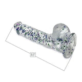 The Glittergasm Dong – Blue and Green Swirl 7" by Icon Brands is a clear glass toy with blue and green swirls inside. Shown on a white background, it's harness compatible and adds sparkle to your collection.