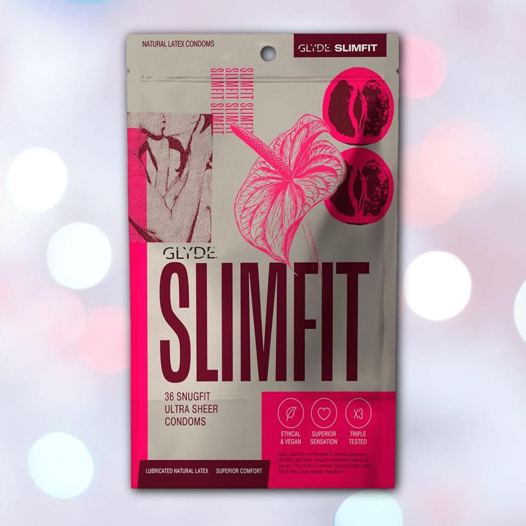 A box of Glyde SlimFit Small Size Condoms by Glyde in red, labeled "36 snug fit ultra sheer condoms," with images of small condoms and a flower on a light background with white bokeh circles.