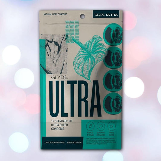 A beige and teal box of Glyde Ultra Super-Thin Condoms by Glyde. The pack states "12 standard fit ultra sheer condoms" with eco-inspired images, showcasing these vegan, eco-friendly condoms. 1080
