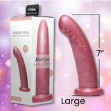 The Fleshlight HerSpot Golden Rose Dildo by Fleshlight, shown in "Large" (7-inch), features a pink, curved design made from platinum-cured silicone. It's pictured next to its box on a shimmering light background with sparkling bokeh.