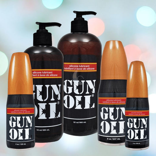 Five bottles of the GUN OIL Silicone Lubricant by Gun Oil, available in different sizes, are on display. The backdrop features a gentle, colorful bokeh effect that emphasizes the long-lasting benefits of its silicone-based formula. 1080