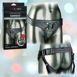 A product image featuring the "Her Royal Harness The Regal Empress Pewter" by CalExotics. The main image displays the vegan leather harness worn on a mannequin, showcasing front and back views. The product packaging is visible on the left, detailing features like the crotchless design, adjustable straps, and interchangeable rings.