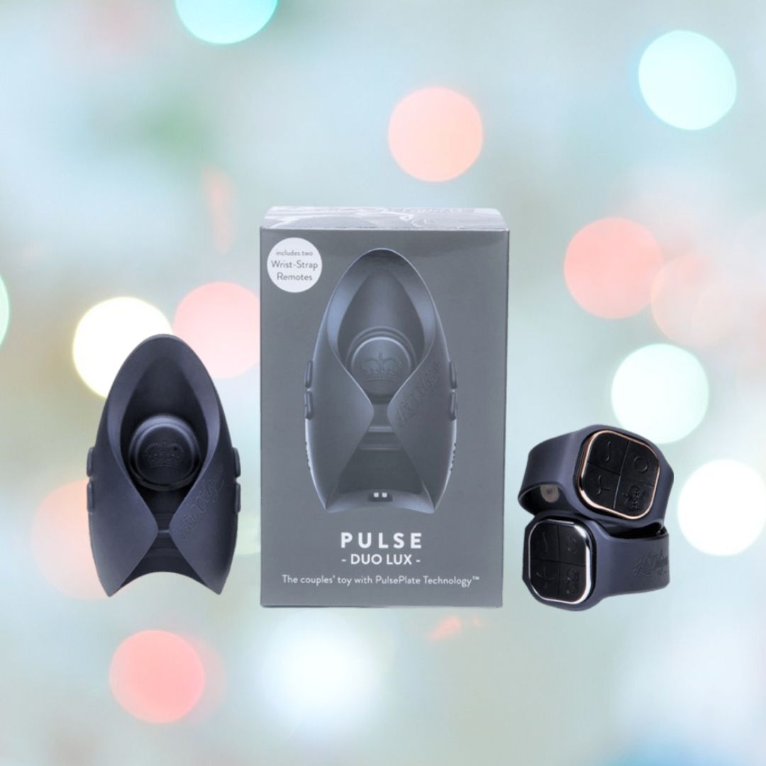 The Hot Octopuss Pulse DUO LUX Couples Vibrator is elegantly showcased against a softly blurred backdrop. Its packaging emphasizes the product's features and branding, while the stylish, wearable device—equipped with dual wrist-strap remotes—provides a hands-free climax experience.