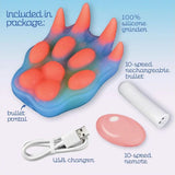 The Icon Brands Alien Nation Pantera Grinder features a glow-in-the-dark silicone animal paw shape, plus a white bullet vibrator, pink remote, and USB charger—everything you need in one clearly labeled package.