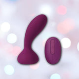 The Svakom JULIE Wearable Anal & G-Spot Vibrator with Remote Control, crafted in purple silicone, rests quietly on a soft, pastel bokeh background.