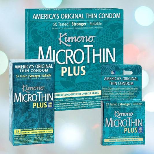 Three packages of Kimono Microthin Plus Aqua Lube Condoms in blue-green packaging feature "America's Original Thin Condom," "5X Tested," "Stronger," and "Reliable." Available in various quantities: a large box, a medium box of 12, and a small single pack. These vegan latex condoms from the Kimono brand come with Aqua Lube lubricant. 1080