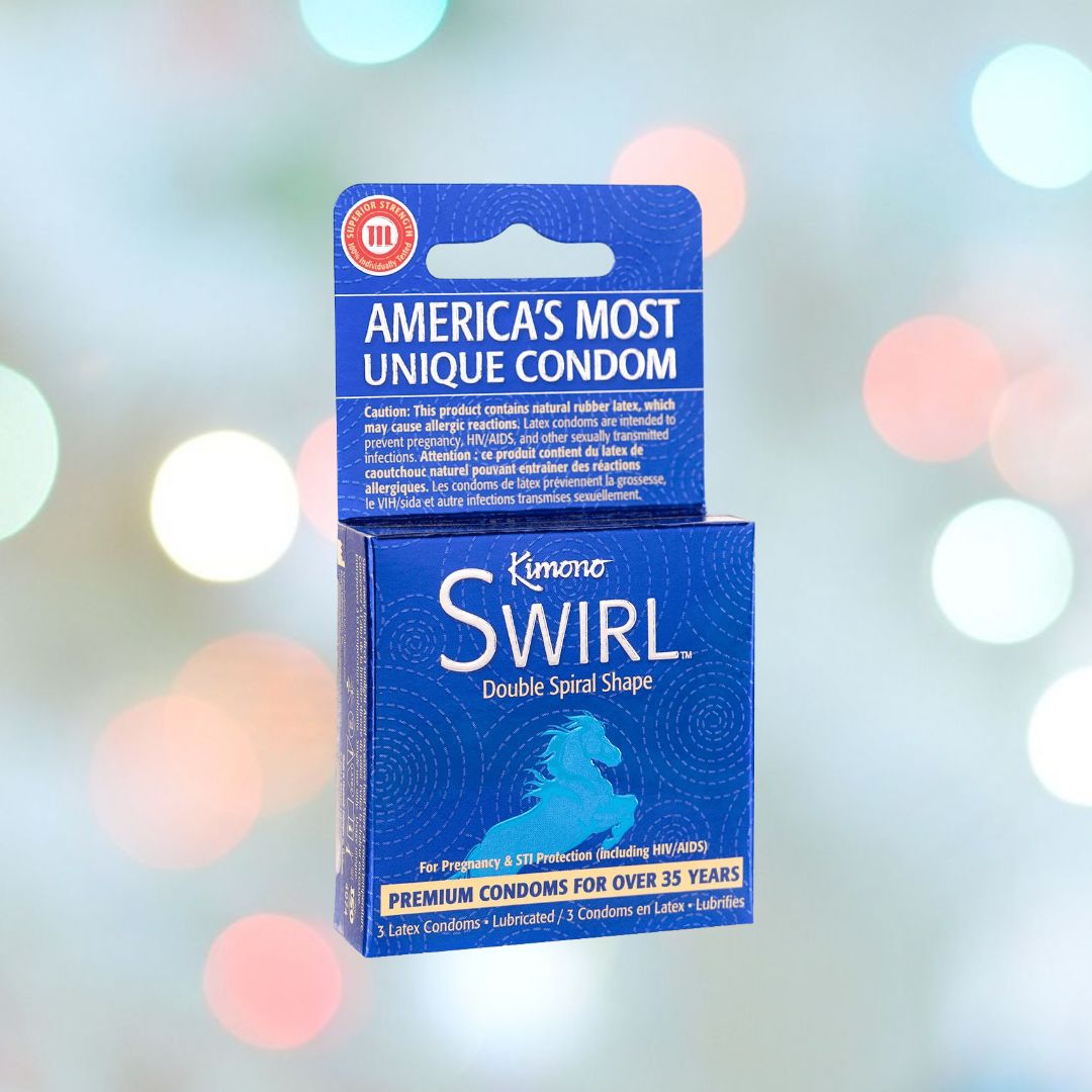 A package of Kimono Swirl Double-Spiral Shape Condoms proudly displays "America's Most Unique Condom" on the top flap. The blue packaging emphasizes its "Double Helix Shape" and "Premium Vegan Latex," reflecting Kimono's dedication to quality for over 35 years. A blurred background with colorful lights adds to its appeal.