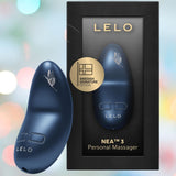 The LELO Nea 3 - Alien Blue female massager is shown beside its sleek black box with gold text and a "Swedish Signature Design" badge, softly lit by pastel hues to highlight its elegance and advanced pleasure features.