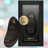 The LELO Nea 3 - Pitch Black, a sleek black handheld vibrator with gold fairy-like detailing, is displayed beside its black box packaging featuring a clear window showcasing the device and the LELO logo.