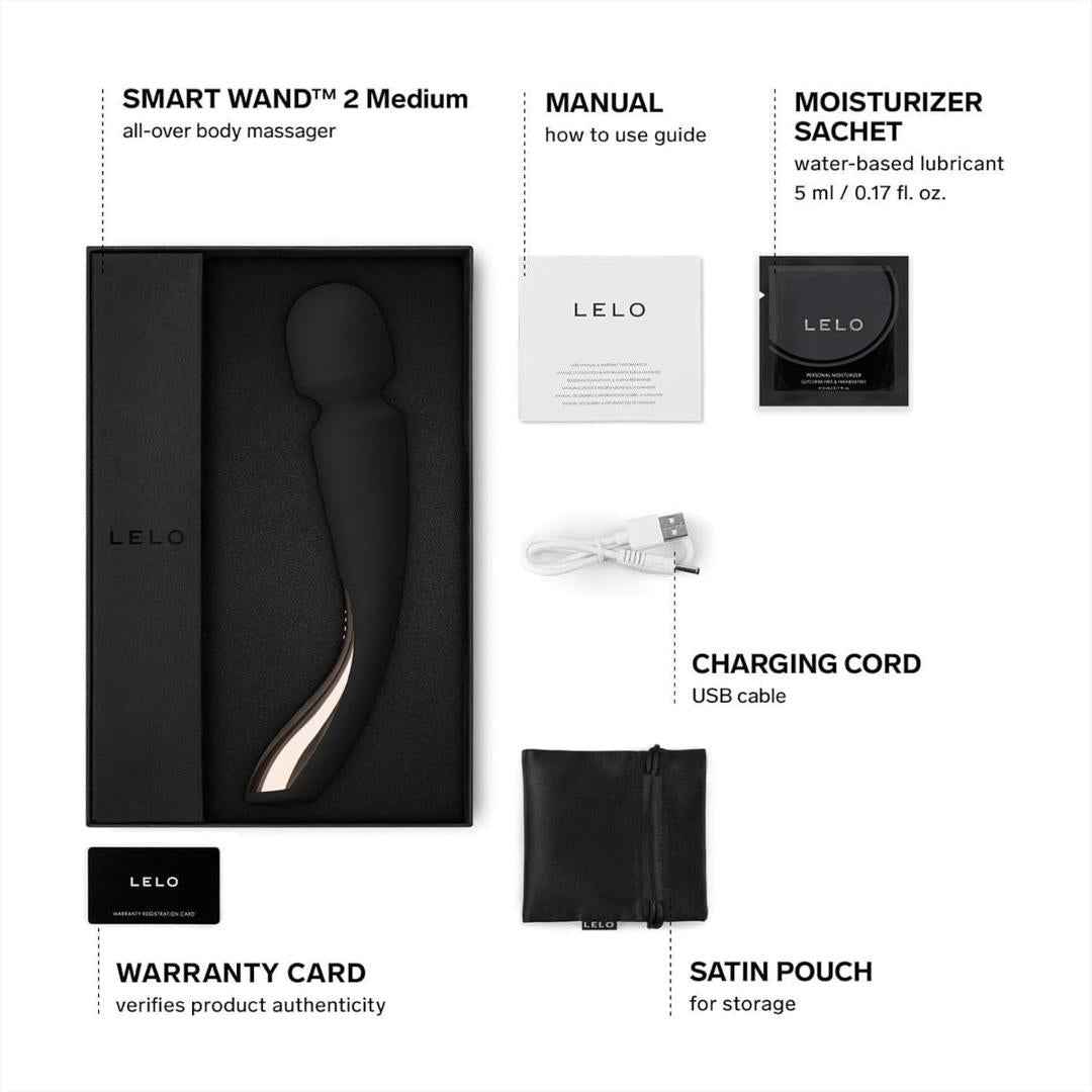 A black LELO Smart Wand 2 Medium Personal Wand Massager by LELO is shown boxed with labeled accessories: manual, moisturizer sachet, charging cord, warranty card, and satin pouch—all arranged on a white background.