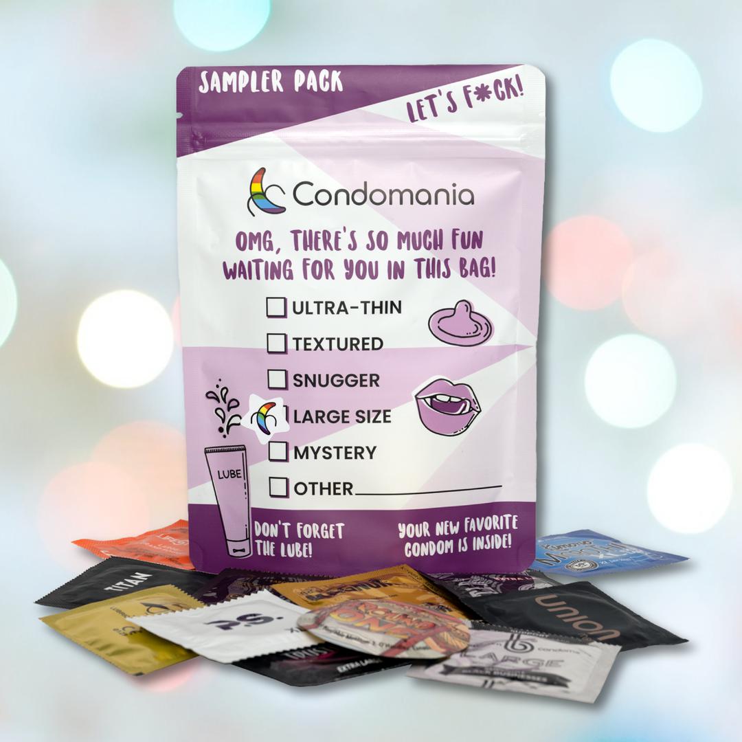 The Large Size Condom Sampler from Condomania is displayed, showcasing ultra-thin, textured, and snuggler types. Vibrant wrappers include the Kimono MicroThin Large for those desiring large condoms with enhanced sensitivity.