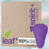 A brown box labeled "Leaf + Spirit Panty Vibe - Purple" by BMS stands beside a small, purple, leaf-shaped device. The box features a 100% silicone finish, rechargeable battery, wireless remote control, and multiple intensities.