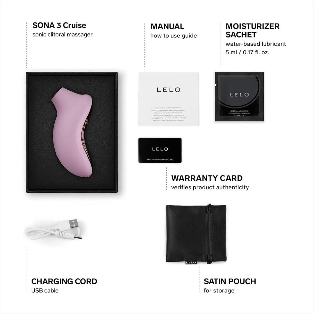 The LELO Sona 3 Cruise - Soft Pink comes in a black box with a manual, moisturizer sachet, warranty card, USB charging cord, and black satin pouch arranged neatly around it.