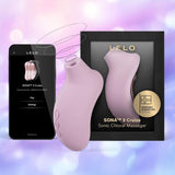 The LELO Sona 3 Cruise - Soft Pink is shown next to its black and gold box and a smartphone displaying its app controls, with a soft purple and blue background.
