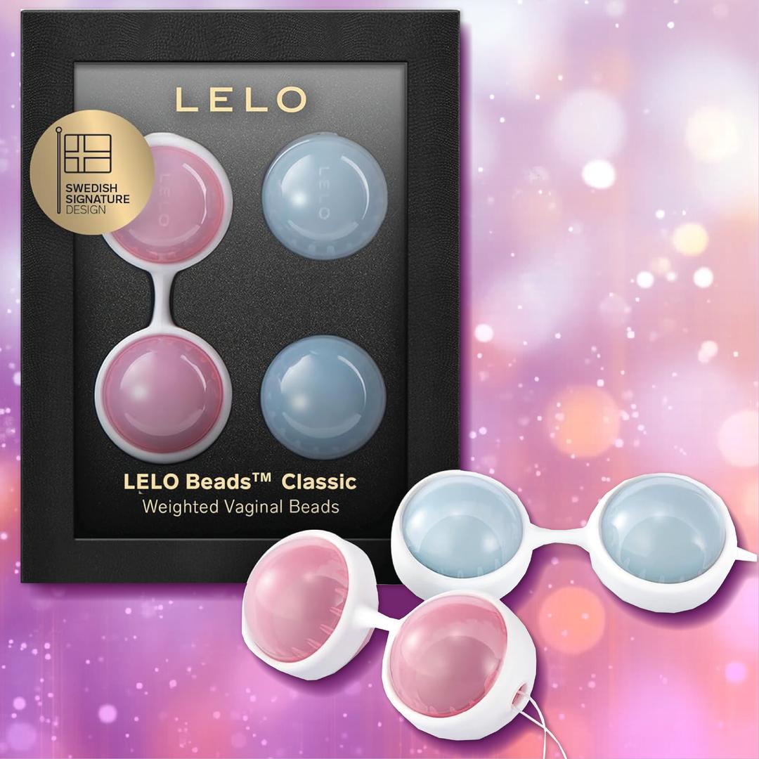 A boxed set of Lelo LELO Luna Beads: Pelvic Floor Training Kegel Balls in pink and blue, shown in packaging and arranged outside against a purple bokeh background—ideal for enhancing pelvic floor wellness.