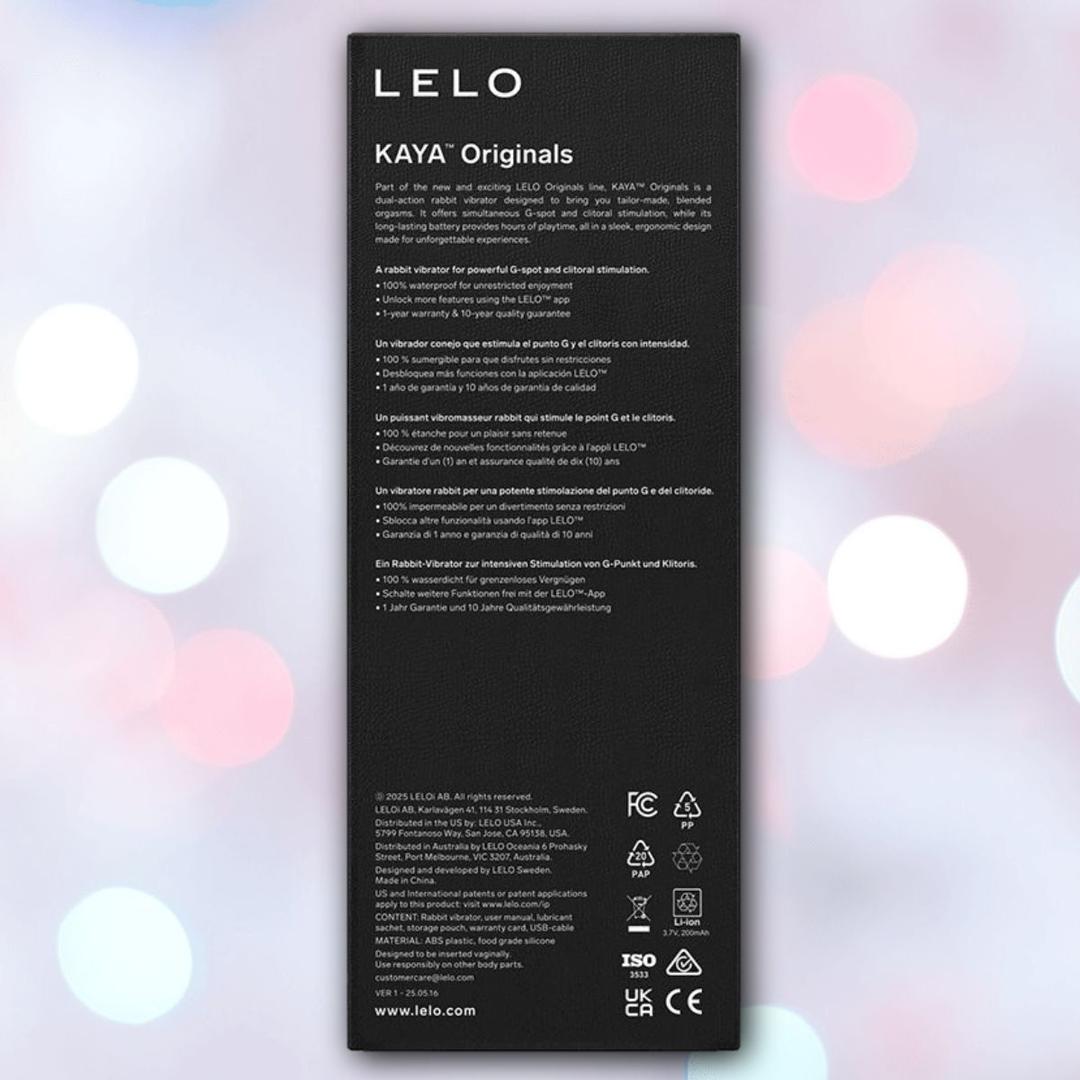 A purple product box for LELO MOKA Originals, a waterproof vibrator with white text highlighting its features, sits against a backdrop of blurred pink, blue, and white lights. Ideal as a G-spot vibe alternative from LELO.