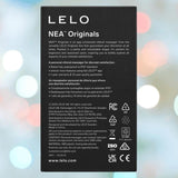 Box for LELO NEA Originals Purple by LELO displays English and Spanish product details, care instructions, certification logos, and company info on a pastel bokeh background.