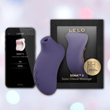 The LELO Sona 3 - Cyber Purple, featuring advanced SenSonic technology, is displayed beside its packaging and a smartphone with the LELO app. The soft, pastel bokeh background adds a gentle touch.