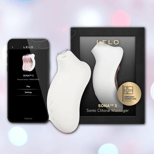 The image displays the LELO Sona 3 - Cream with SenSonic technology next to its box, which features gold LELO branding, and a smartphone showing the LELO app. The white massager has curved edges. 1080