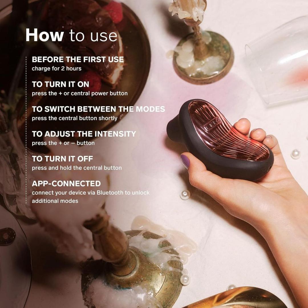 A hand holds the LELO Sona 3 Cruise in Black near lit candles on marble. On-screen text shows how to charge, turn on, adjust intensity, and connect the device via Bluetooth.