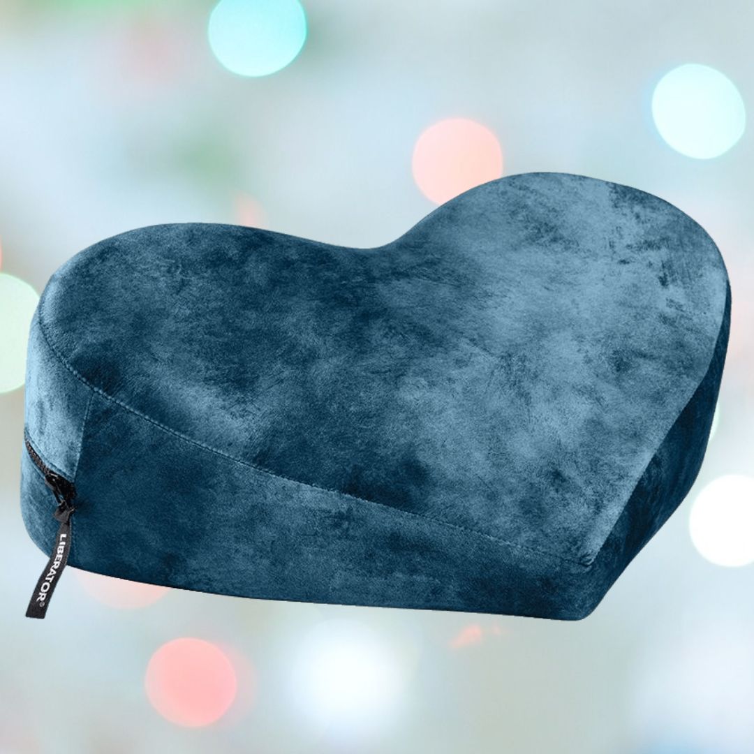 The Liberator Heart Wedge Ibiza Collection in Ocean Blue by Liberator is a stylish, heart-shaped decorative pillow with a side zipper, perfect as chic decor and ideal for comfortable G-spot positioning.