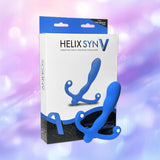 The Aneros Helix Syn V Special Edition Blue prostate stimulator and packaging are shown against a blurred pink and purple background. Its ergonomic curves and flexible arms deliver targeted prostate stimulation for enhanced pleasure.