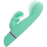 The CalExotics Love Bunny Rockin’ “G” Bunny is a teal, curved silicone vibrator with a smaller external stimulator and a purple accent ring, shown with motion blur to indicate vibration.