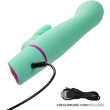 The Love Bunny Rockin’ “G” Bunny by CalExotics, a teal silicone vibrator with a curved tip, is pictured alongside its USB charging cord and plug, showing that the charging cable is included.