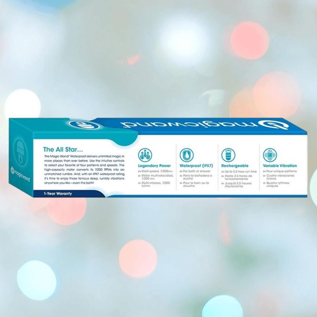 A blue and white box labeled "Magic Wand Waterproof Massager" by Magic Wand highlights legendary power, deep vibrations, a waterproof build, and rechargeable battery. The cordless massager appears against a pastel bokeh background.