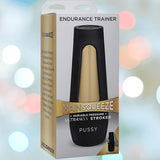 The Doc Johnson Main Squeeze Endurance Trainer Stroker Pussy - Vanilla comes in black and gold packaging, with blurred colorful lights in the background.