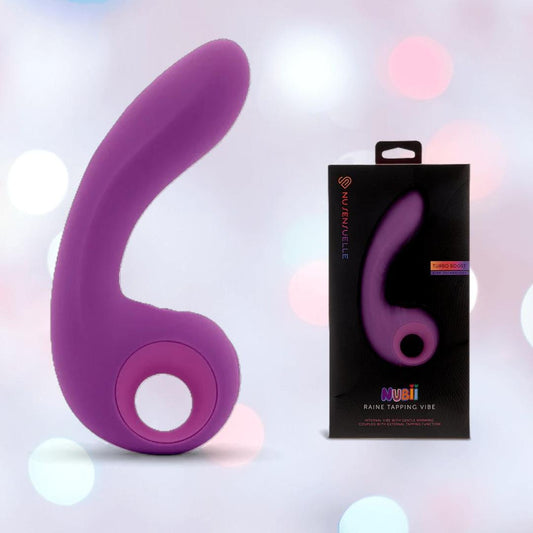 The Nu Sensuelle Nubii Raine Tapping Vibrator with Warming and Turbo Boost in purple by NOVEL CREATIONS USA is shown beside its packaging, against a pastel-lit background. This waterproof silicone toy features a modern, ergonomic design. 1080
