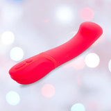 The Nu Sensuelle Velvet Touch Luna Vibrator with Turbo Boost by NOVEL CREATIONS USA is a bright pink, curved silicone toy featuring two base buttons and 20 vibration patterns, displayed against a soft, pastel-toned background.