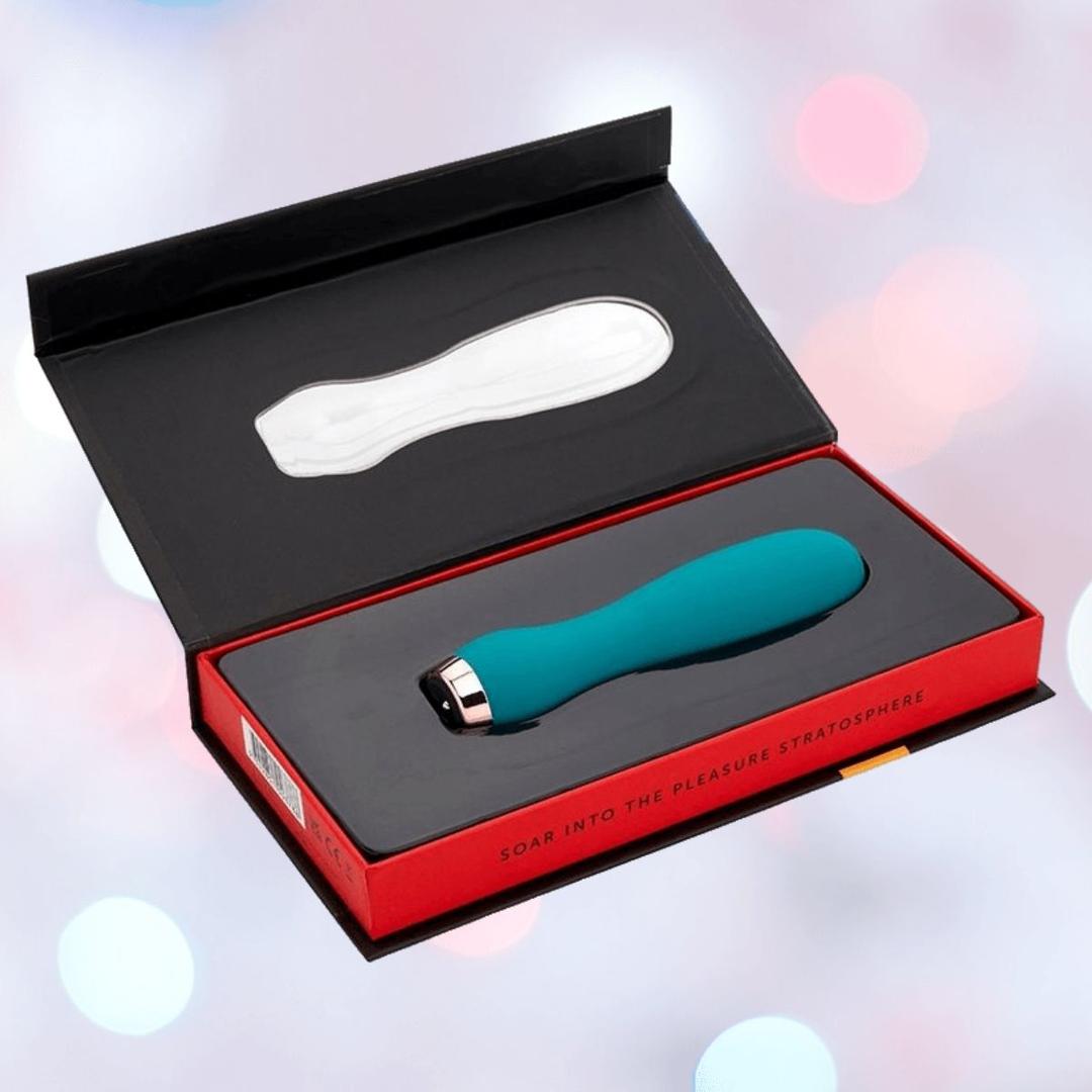 The Nu Sensuelle Velvet Touch Skye Vibrator with Turbo Boost by NOVEL CREATIONS USA comes in emerald green, offers 20 vibration settings, and is presented in a red and black gift box with a molded insert and the message "Soar into the pleasure stratosphere.