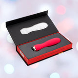 The Nu Sensuelle Velvet Touch Skye Vibrator with Turbo Boost by NOVEL CREATIONS USA in hot pink features 20 vibration functions and comes stylishly packaged in a black and red box with molded insert against a soft, pastel-lit backdrop.