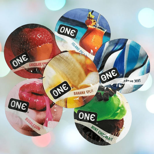 A set of six colorful, vegan-friendly condom wrappers from the ONE Flavor Waves Condom Variety Pack, artfully displayed in a circle. Each wrapper proudly showcases a distinct flavor label: chocolate strawberry, island punch, fresh mint, bubblegum, banana split, and mint chocolate. The background is adorned with a gentle blurred bokeh effect. 1080