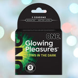 A sleek black box branded as "ONE Glowing Pleasure" presents glow-in-the-dark condoms crafted from natural rubber latex. The package emphasizes its "Senastex Softer Latex" and includes three triple-tested condoms, ideal for intimate occasions. The background is adorned with a bokeh effect comprised of gentle pastel lights.