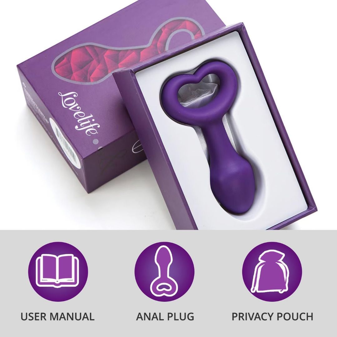 The OhMiBod Lovelife Explore Butt Plug - Purple by OhMiBod is shown in an open box with a heart-shaped handle. This smooth anal plug set includes a user manual and privacy pouch, all in coordinated purple packaging.