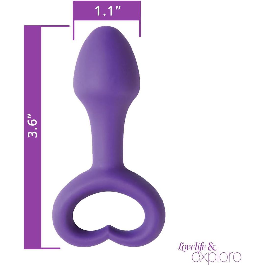 The OhMiBod Lovelife Explore Butt Plug in purple silicone features a smooth, flexible design with a heart-shaped handle and measures 3.6" x 1.1"—perfect for shared adventure. "Lovelife & explore" appears in the lower right corner.