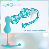 The OhMiBod Lovelife Krush Smart Kegel Fitness in Turquoise is shown before its packaging, which displays the product design and "FOR SMART KEGEL FITNESS & FUN." Ideal for pelvic floor fitness with Bluetooth-enabled features.