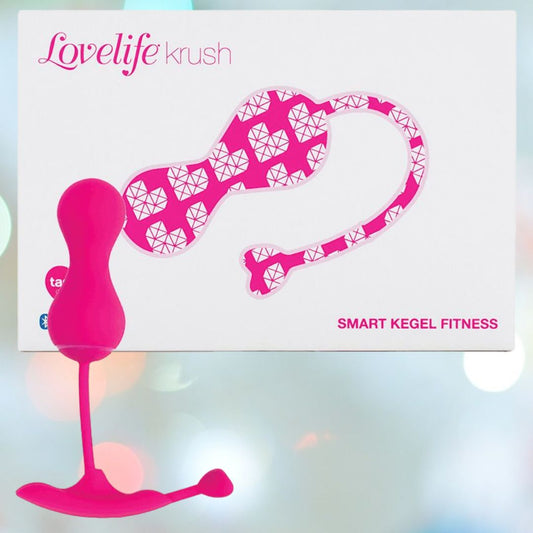 The OhMiBod Lovelife Krush Smart Kegel Fitness in pink is shown before its white box, adorned with pink and white heart patterns and “SMART KEGEL FITNESS”—a stylish pelvic floor fitness device from OhMiBod. 1080